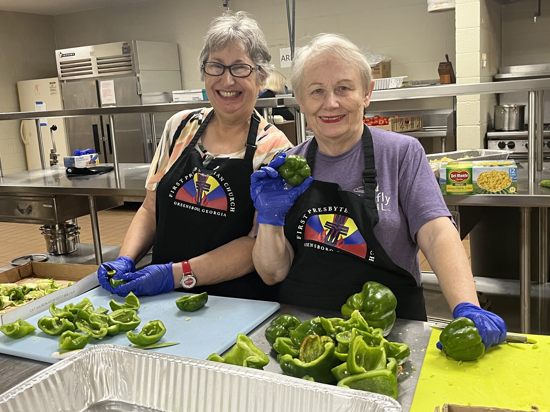 Volunteers preparing the meal in the kitchen